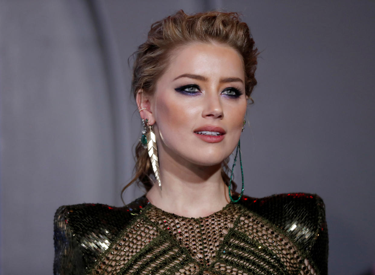 Amber Heard will return for Aquaman 2 and thanks fans for support after Johnny Depp loses libel lawsuit. 