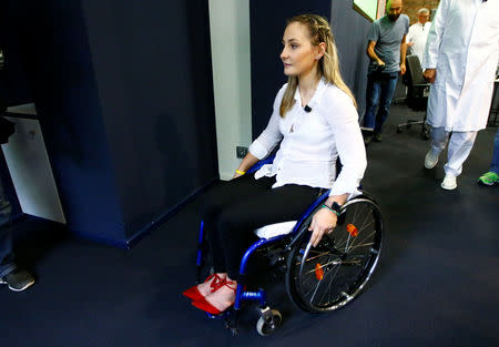 Germany's Olympic and world sprint cycling champion Kristina Vogel leaves a news conference after talking to the media for the first time since being paralysed following a serious crash in training at the Unfallkrankenhaus hospital in Berlin, Germany, September 12, 2018. REUTERS/Fabrizio Bensch