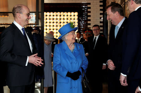Britain's Queen Elizabeth meets with GCHQ Director Jeremy Fleming as she visits Watergate House to mark the centenary of the GCHQ (Government Communications Head Quarters) in London, Britain, February 14, 2019. REUTERS/Hannah McKay/Pool