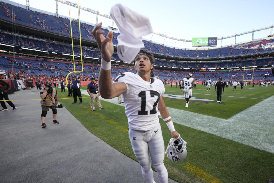 Las Vegas Raiders wide receiver Willie Snead (17) throws his towel to fans after an NFL football game against the Denver Broncos, Sunday, Oct. 17, 2021, in Denver. The Raiders won 34-24. (AP Photo/David Zalubowski)