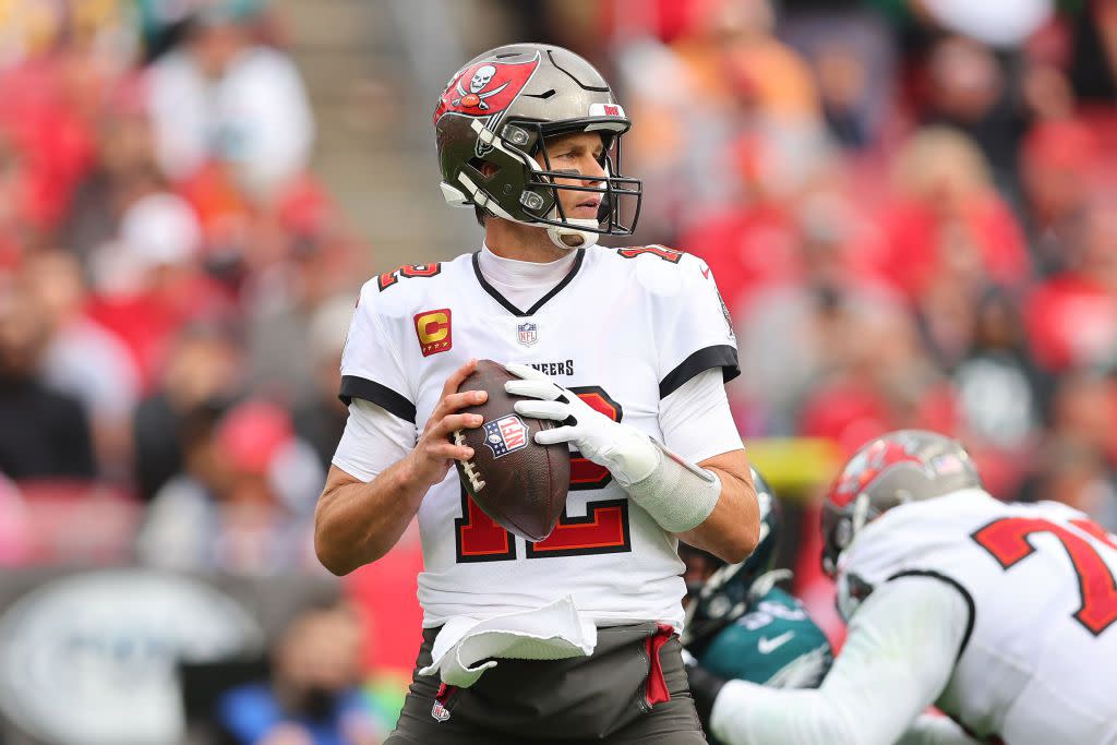 Tom Brady #12 of the Tampa Bay Buccaneers looks to pass against the Philadelphia Eagles in the first half of the NFC Wild Card Playoff game at Raymond James Stadium on January 16, 2022 in Tampa, Florida.