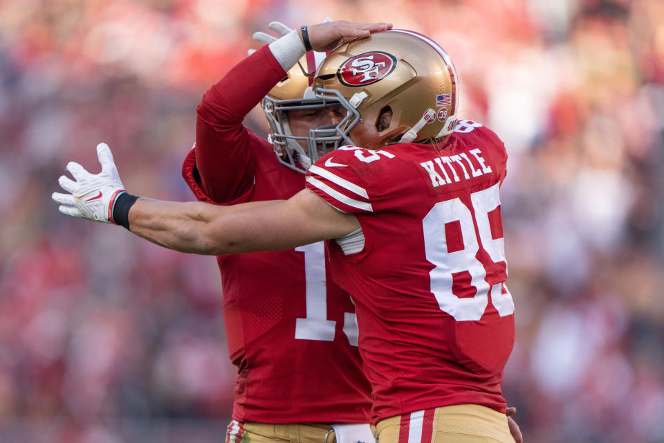 Dec 24, 2022; Santa Clara, California, USA; San Francisco 49ers quarterback Brock Purdy (13) and tight end George Kittle (85) celebrate during the third quarter against the Washington Commanders at Levi's Stadium. Mandatory Credit: Stan Szeto-USA TODAY Sports