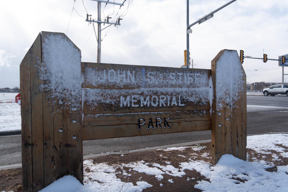 The entrance sign for John Stiff Park near Coulter Street is covered in snow as Amarillo gets its first significant snow of the season Saturday monring.