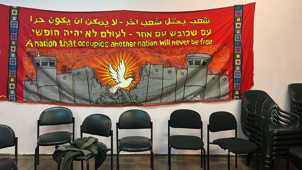 "A nation that occupies another nation will never be free," reads a banner at a left wing community space in Tel Aviv, November 27, 2023. - Tara John/CNN