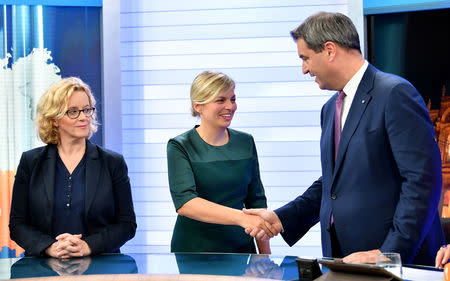 Social Democratic Party (SPD) top candidate Natascha Kohnen, the Greens party top candidate Katharina Schulze and Bavarian Prime Minister Markus Soeder take part in an interview at a TV studio following the Bavarian state election in Munich, Germany, October 14, 2018. Lukas Barth-Tuttas/Pool via Reuters