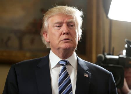 U.S. President Donald Trump speaks during the Inaugural Law Enforcement Officers and First Responders Reception in the Blue Room of the White House in Washington, U.S., January 22, 2017. REUTERS/Joshua Roberts