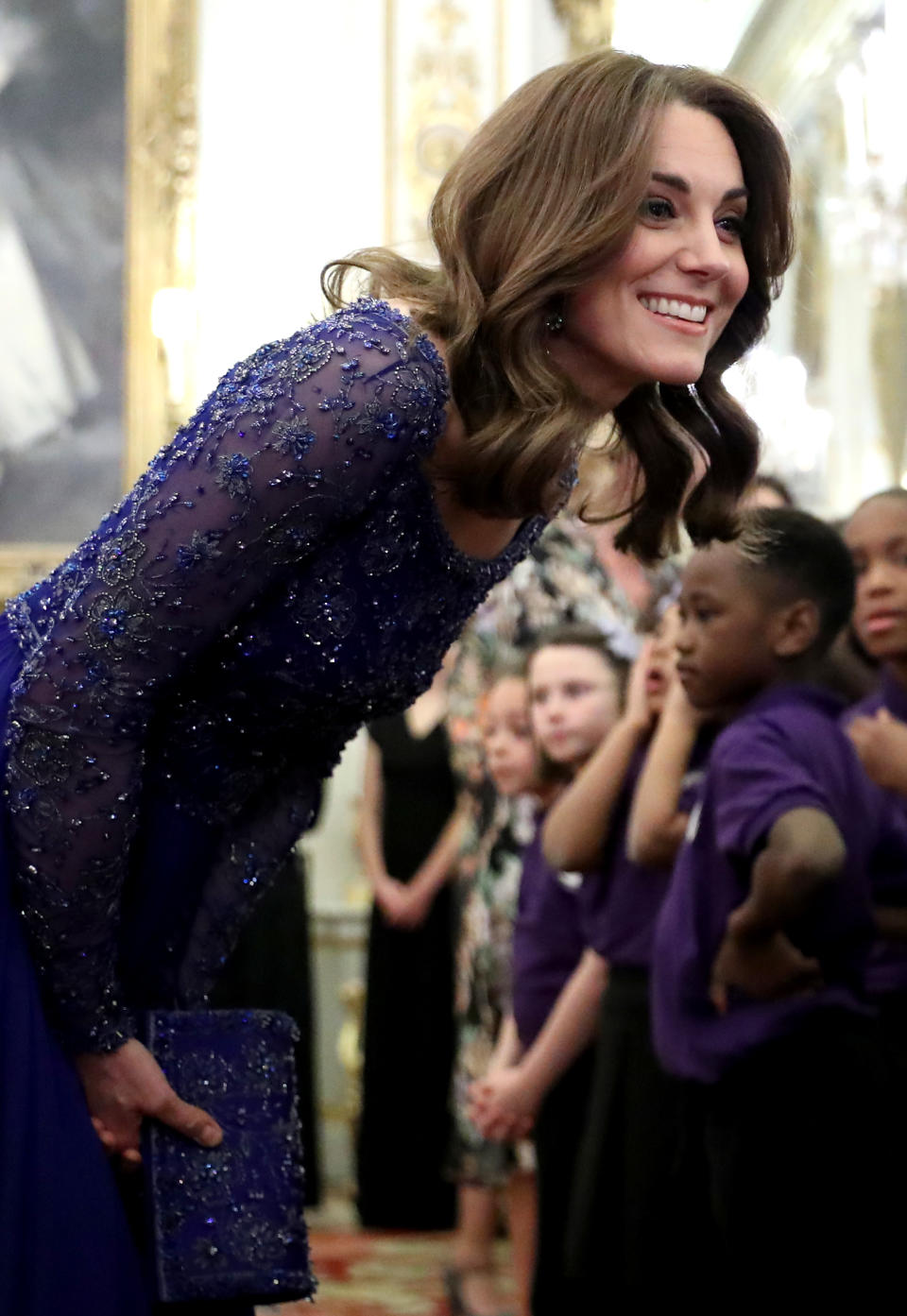 LONDON, ENGLAND - MARCH 09: Catherine, Duchess of Cambridge speaks with a school choir as she hosts a Gala Dinner in celebration of the 25th anniversary of Place2Be at Buckingham Palace on March 09, 2020 in London, England. The Duchess is Patron of Place2Be, which provides emotional support at an early age and believes no child should face mental health difficulties alone. (Photo by Chris Jackson - WPA Pool/Getty Images)