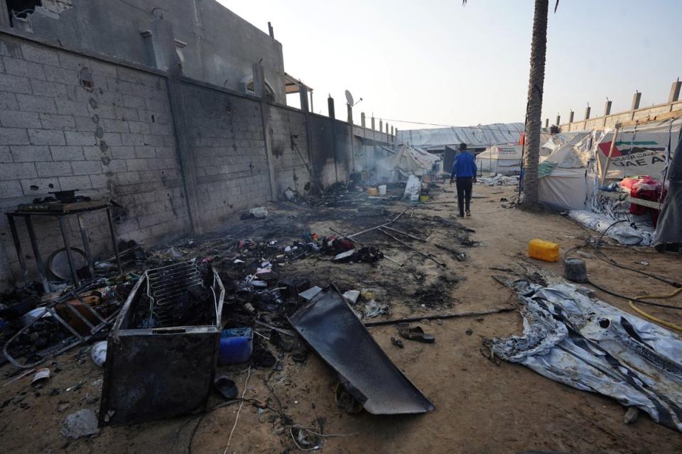 A man walks past destroyed tents the day after an Israeli strike in Mawasi near Rafah, Gaza (AFP via Getty)