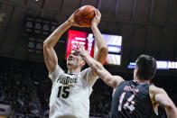 Purdue's Zach Edey (15) shoots over Omaha's Dylan Brougham (14) during the second half of an NCAA college basketball game in West Lafayette, Ind., Friday, Nov. 26, 2021. Purdue defeated Omaha 97-40. (AP Photo/Michael Conroy)