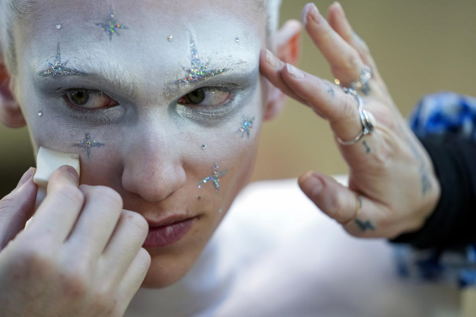A model has make-up applied backstage ahead of the Thom Browne collection presentation during Fashion Week, Tuesday, Feb. 14, 2023, in New York. (AP Photo/Mary Altaffer)