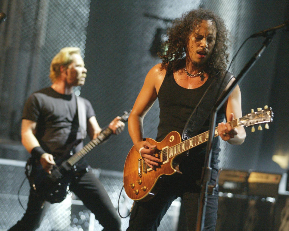 UNIVERSAL CITY, CA - MAY 3:  Kirk Hammett and James Hetfield of Metallica perform on stage at the mtvICON: Metallica tribute special held at the Universal Amphitheatre on May 3rd, 2003 in Universal City, California.  mtvICON: Metallica will premiere on MTV Tuesday, May 6th at 9:00PM [ET/PT].  (Photo by Kevin Winter/Getty Images)
