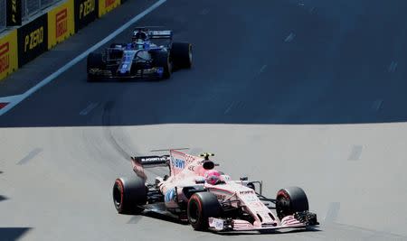 Formula One - F1 - Azerbaijan Grand Prix - Baku, Azerbaijan - June 24, 2017. Sauber's Marcus Ericsson (back) and Force India's Esteban Ocon drive during the third practice session. REUTERS/David Mdzinarishvili
