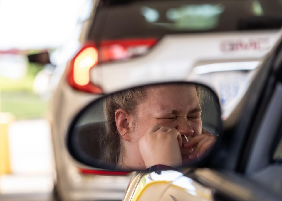 Sophia Schiepek, 19, of Roger City, takes part in a voluntary coronavirus test during a move-in day for students at Lake Superior State University in Sault Ste. Marie in Michigan's Upper Peninsula on Aug. 5.