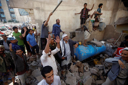 People react at the site of an air strike launched by the Saudi-led coalition in Sanaa, Yemen May 16, 2019. REUTERS/Mohamed al-Sayaghi