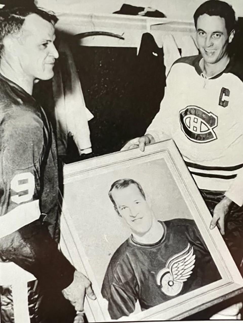 Jean Beliveau, captain of the Montreal Canadiens, presents Gordie Howe with a gift portrait the night Howe broke the all-time scoring record of Montreal’s Maurice “The Rocket” Richard.