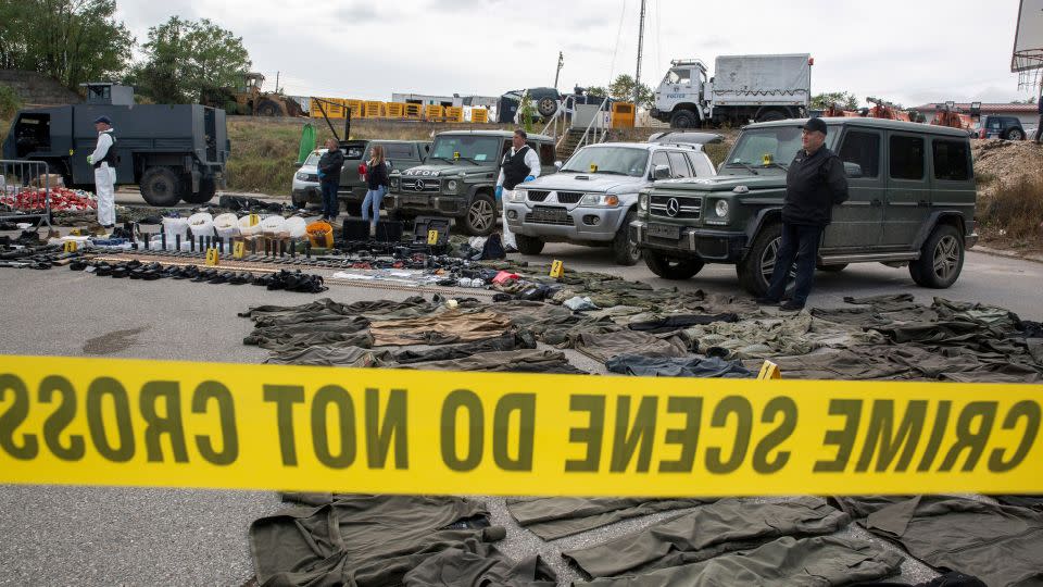 Kosovo police officers display seized weapons and military equipment during the police operation in Banjska. - Visar Kryeziu/AP