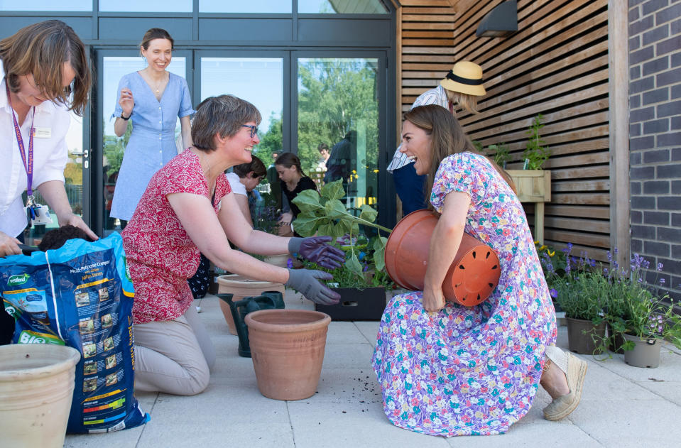 EMBARGOED: No onward transmission before 2100 BST Sat 27/6/2020. Not for publication before 2200 BST Sat 27/6/2020. The Duchess of Cambridge helps to pot plants and herbs during a visit to The Nook in Framlingham Earl, Norfolk, which is one of the three East Anglia Children's Hospices (EACH).