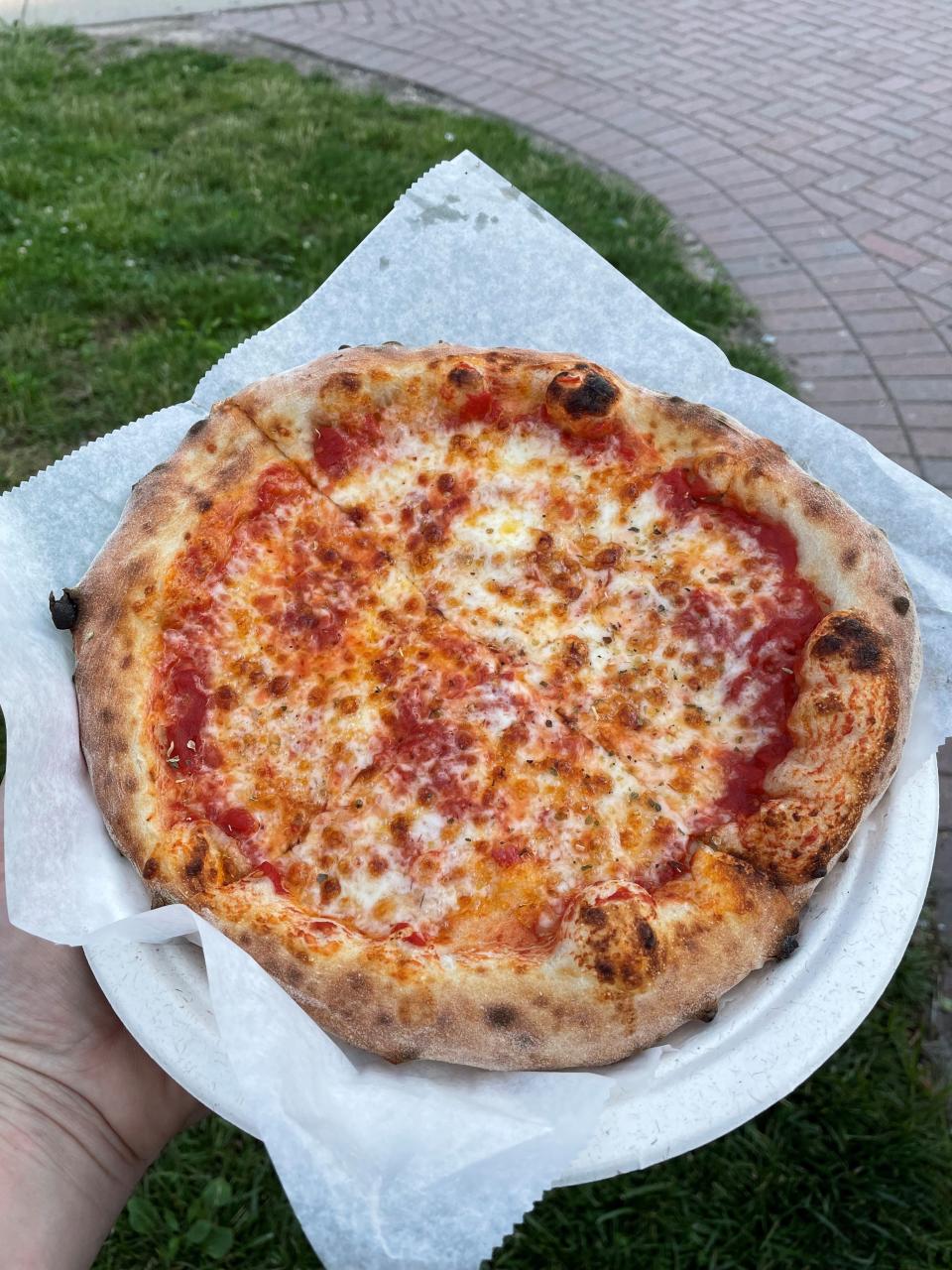 A wood-fired pizza from Woodshed Pizza, a Brick-based mobile pizza business.