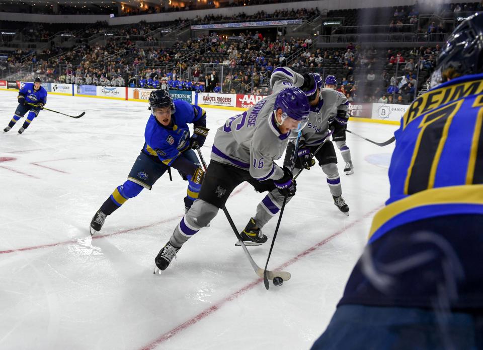 Stampede player Ryan Healey steals the puck from Tri-State Storm player Josh Eernisse on Saturday, December 11, 2021, at the Denny Sanford Premier Center in Sioux Falls.