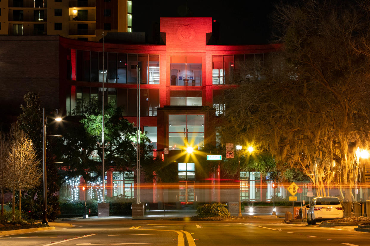 Tallahassee's City Hall is lit in memorial for the over 400,000 Americans who have lost their lives to COVID-19 in the past year as part of the Biden-Harris inauguration's national moment of unity Tuesday, Jan. 19, 2021.