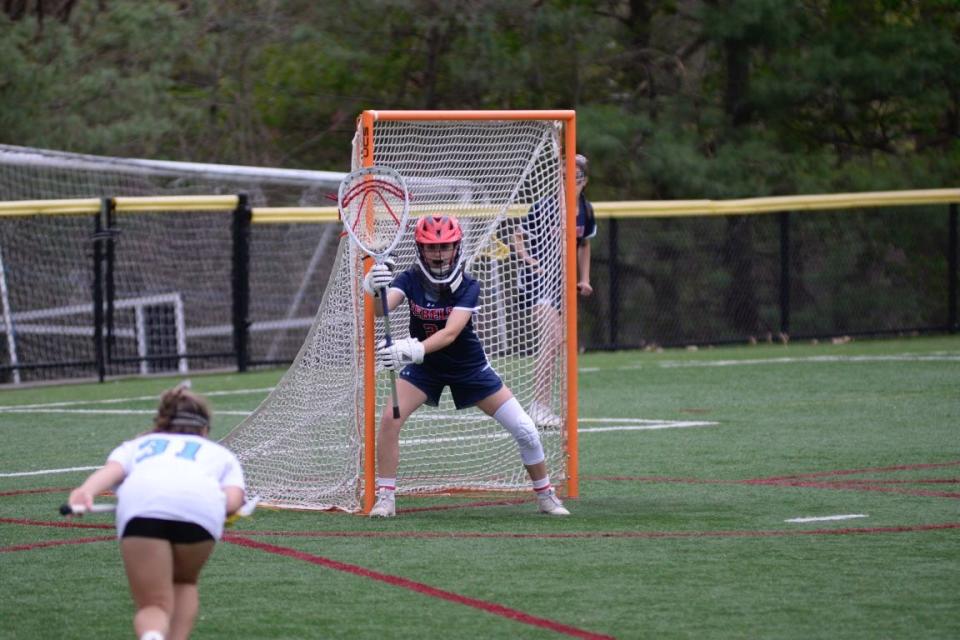 Saddle River Day goalie Mc Salter gets set for a free position during a girls lacrosse game.