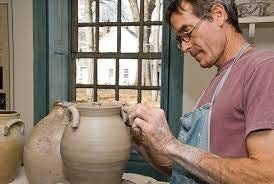 Mark Shapiro is at work on the pottery wheel.