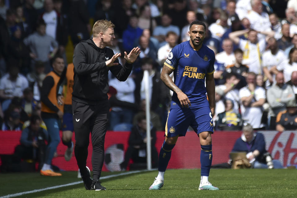 Newcastle's Callum Wilson, right, listens to instructions from his head coach Eddie Howe after scoring his side's first goal from the penalty spot, during the English Premier League soccer match between Leeds United and Newcastle United at Elland Road in Leeds, England, Saturday, May 13, 2023. (AP Photo/Rui Vieira)