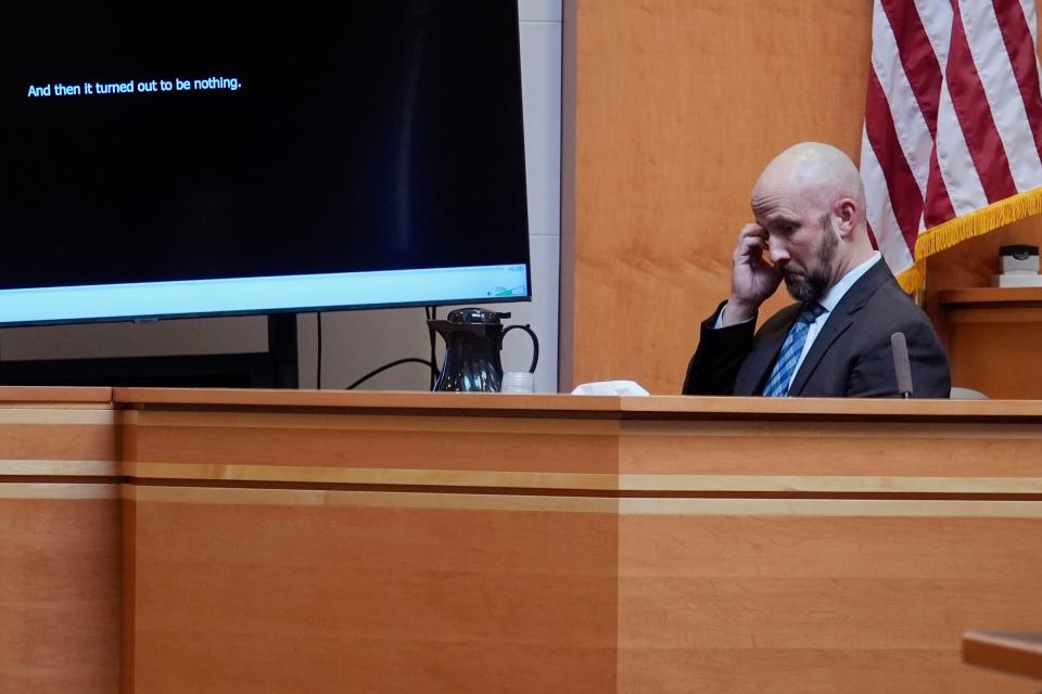 Manchester, N.H. Police Capt. Matthew Larochelle listens to an audio recording of Adam Montgomery during the trial of the Montgomery at Hillsborough County Superior Court, Tuesday, Feb. 20, 2024, in Manchester, N.H. Montgomery is facing second-degree murder and other charges in the death of his daughter, Harmony. (AP Photo/Charles Krupa, Pool)