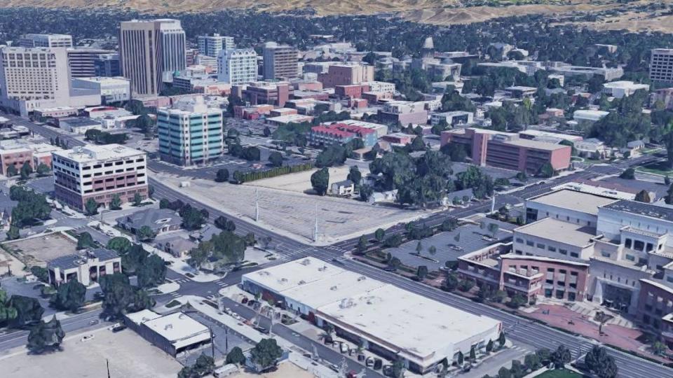 The triangular parking lot at the center of this picture would give way to multifamily housing if Boise’s urban renewal agency gets its way. The parcel is on the northwest corner of Front and 3rd streets. The Ada County Courthouse is at right.