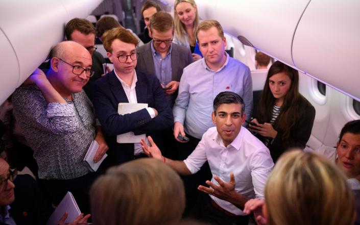 Rishi Sunak speaking to journalists on the plane on the way to the G20 summit. The Prime Minister has called Russia a 'rogue state' - Leon Neal/Getty Images