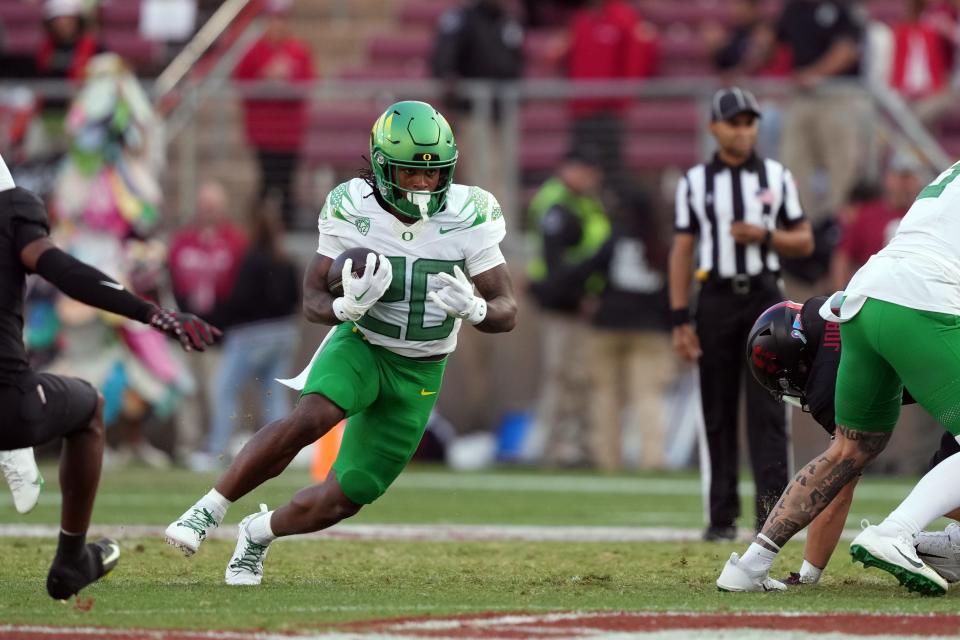 Oregon Ducks running back Jordan James (20) carries the ball against the Stanford Cardinal during the third quarter at Stanford Stadium on Sept. 30 in Stanford, California.