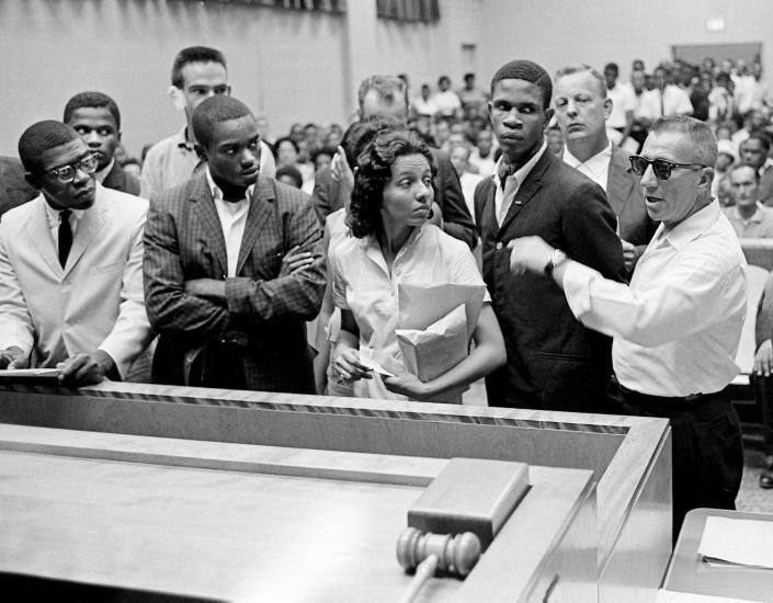 Some of the seven Black people arrested after a racial clash with a group of white youths as they picketed an H.G. Hill store are facing the judge in Nashville City Court Aug. 7, 1961. Diane Nash, center, a leader in the ' demonstration, said she preferred to stay in jail because &quot;it's ridiculous when the police arrest the innocent party.&quot;