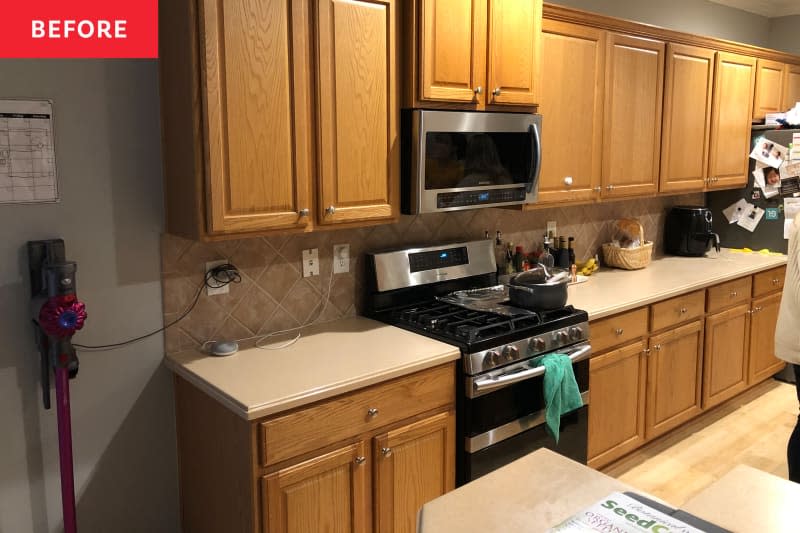 Unrenovated brown and gray kitchen with wooden cabinets