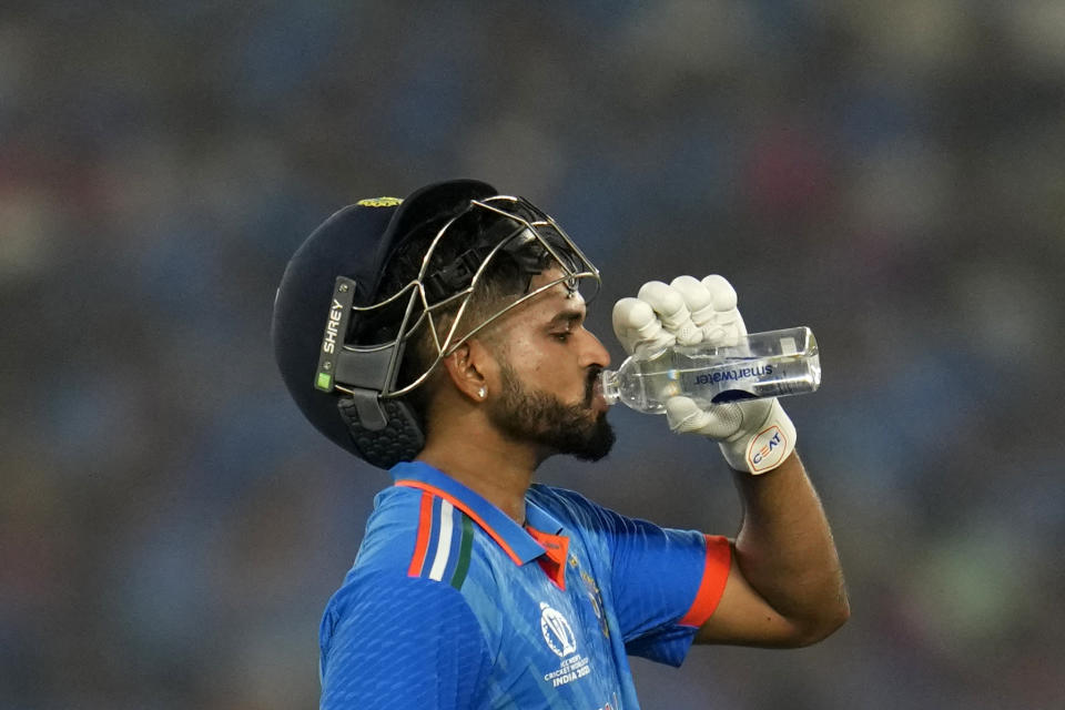 India's Shreyas Iyer drinks water during the ICC Men's Cricket World Cup match between India and Pakistan in Ahmedabad, India, Saturday, Oct. 14, 2023. (AP Photo/Aijaz Rahi)