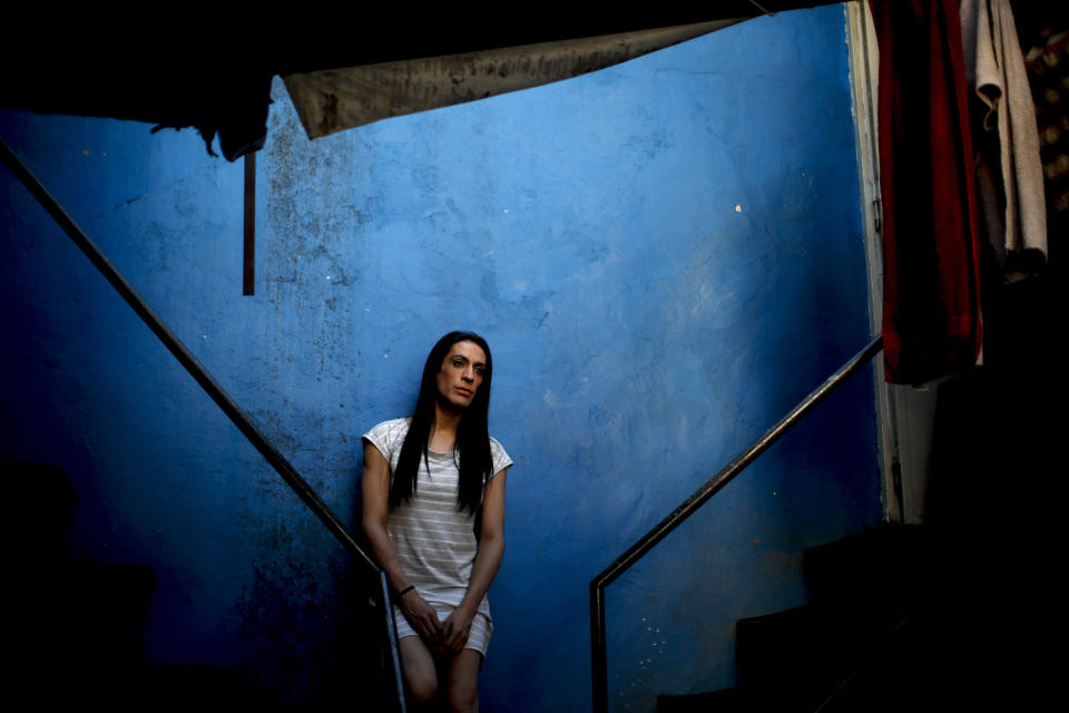 Transgender woman Guadalupe Olivares poses for a photo at the hotel where she lives in Buenos Aires, Argentina, Monday, Nov. 16, 2020. Olivares had a job interview at the Ministry of Social Development after President Alberto Fernández signed a decree establishing a 1% employment quota for transgender people in the public sector. (AP Photo/Natacha Pisarenko)