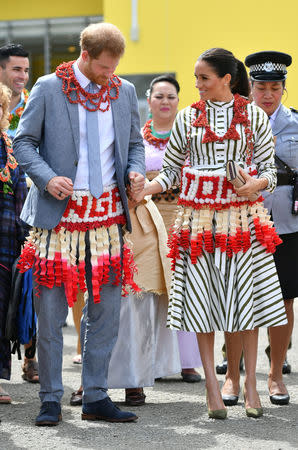 Meghan, Duchess of Sussex and Prince Harry, Duke of Sussex visit an exhibition of Tongan handicrafts, mats and tapa cloths at the Fa'onelua Convention Centre on the second day of the royal couple's visit to Tonga, October 26, 2018. Dominic Lipinski/Pool via REUTERS