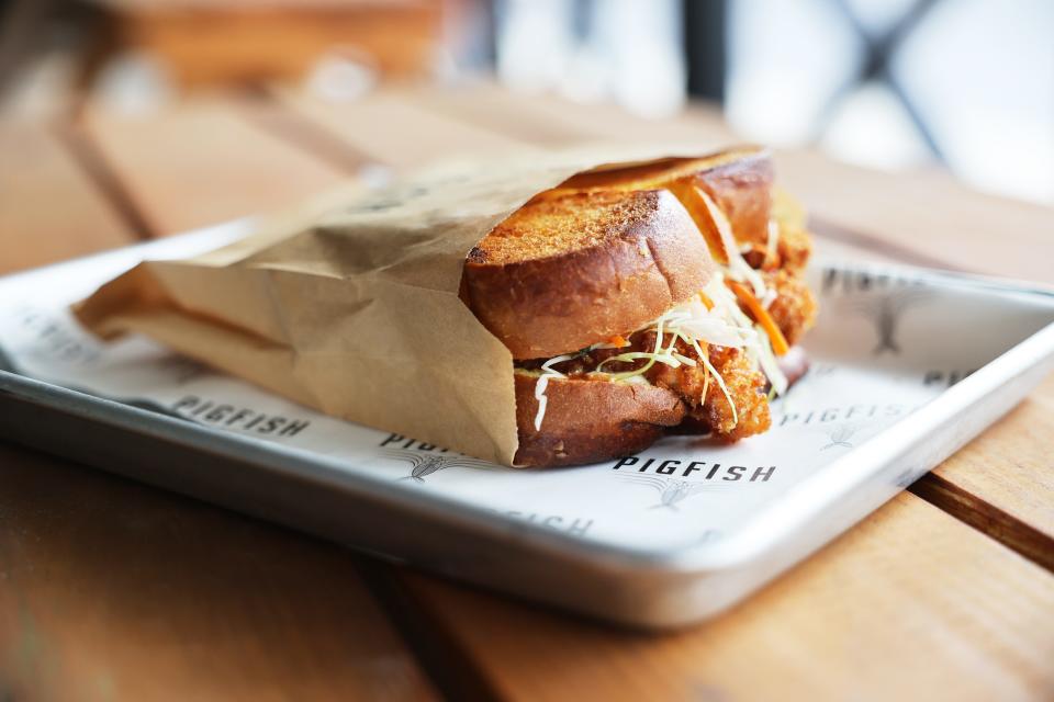 PigFish in Sarasota by award-winning chef Steve Phelps features handhelds such as the signature sandwich made with Forever Oceans' sustainable kanpachi topped by braised pork.