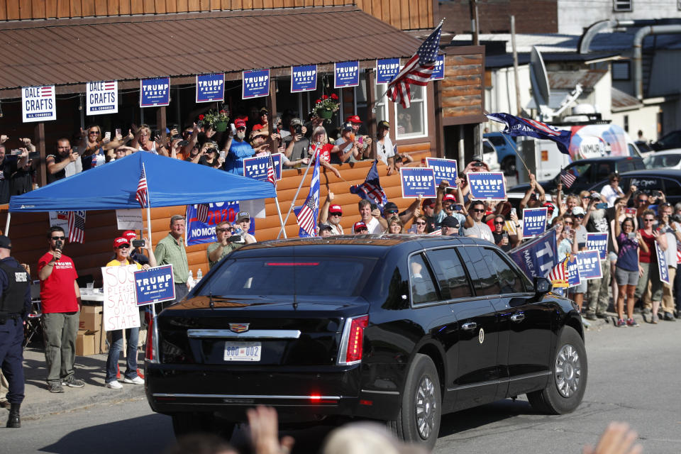 FILE - In this June 5, 2020 file photo, supporters of President Donald Trump cheer as the motorcade passes during Trump's visit to Guilford, Maine. Trump visited Puritan Medical Products, one of the top two makers of testing swabs in the world. Nebraska and Maine aren't exactly swing states in the race to pick the next president, but each one has something to offer next month that could give them a huge amount of sway: a single electoral vote. (AP Photo/Robert F. Bukaty, File)