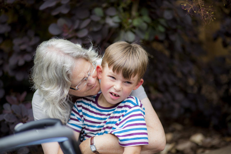 grandma hugging their grandson