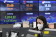 A currency trader watches monitors at the foreign exchange dealing room of the KEB Hana Bank headquarters in Seoul, South Korea, Thursday, June 24, 2021. Shares were mostly higher in Asia on Thursday after a listless day of trading on Wall Street as the recent bout of nerves over Federal Reserve policy fades. (AP Photo/Ahn Young-joon)