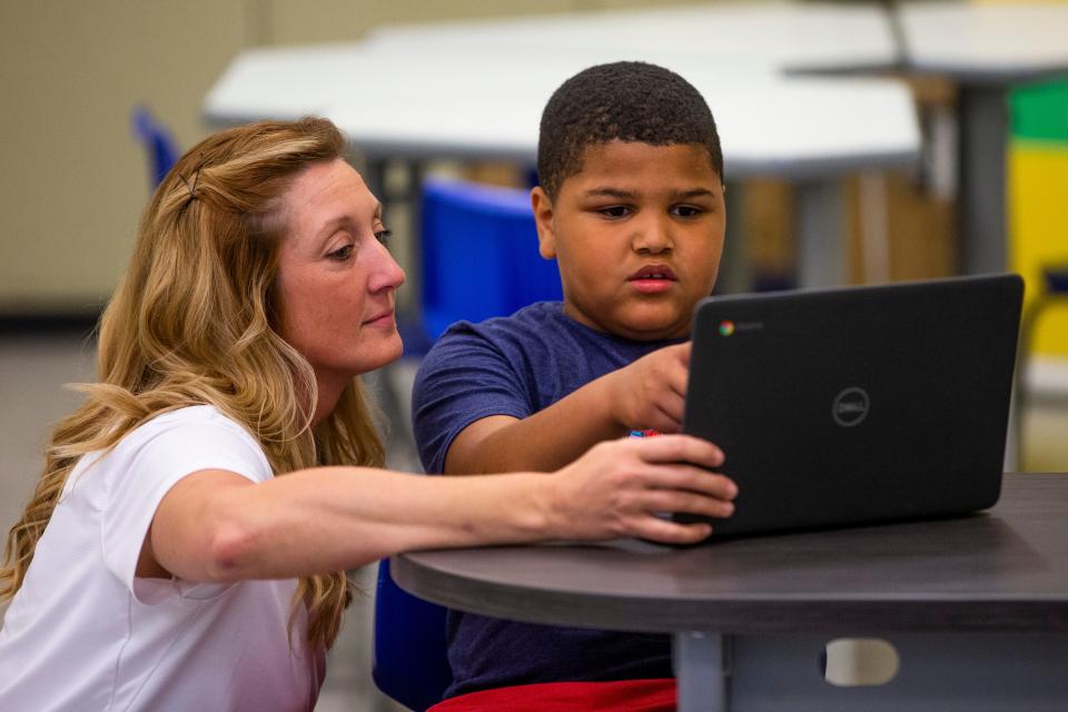 Nikki Tredway helps 9-year-old Wilson Primary third-grader Thomas Dodson with a tutoring assessment at the My Learning Nook inside the University Park Mall in Mishawaka.