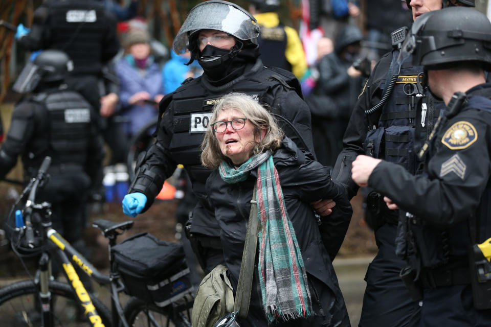 <p>A woman is detained during a protest Monday, Feb. 20, 2017, in Portland, Ore. Thousands of demonstrators turned out Monday across the U.S. to challenge President Donald Trump in a Presidents Day protest dubbed Not My President’s Day. (Dave Killen/The Oregonian via AP) </p>