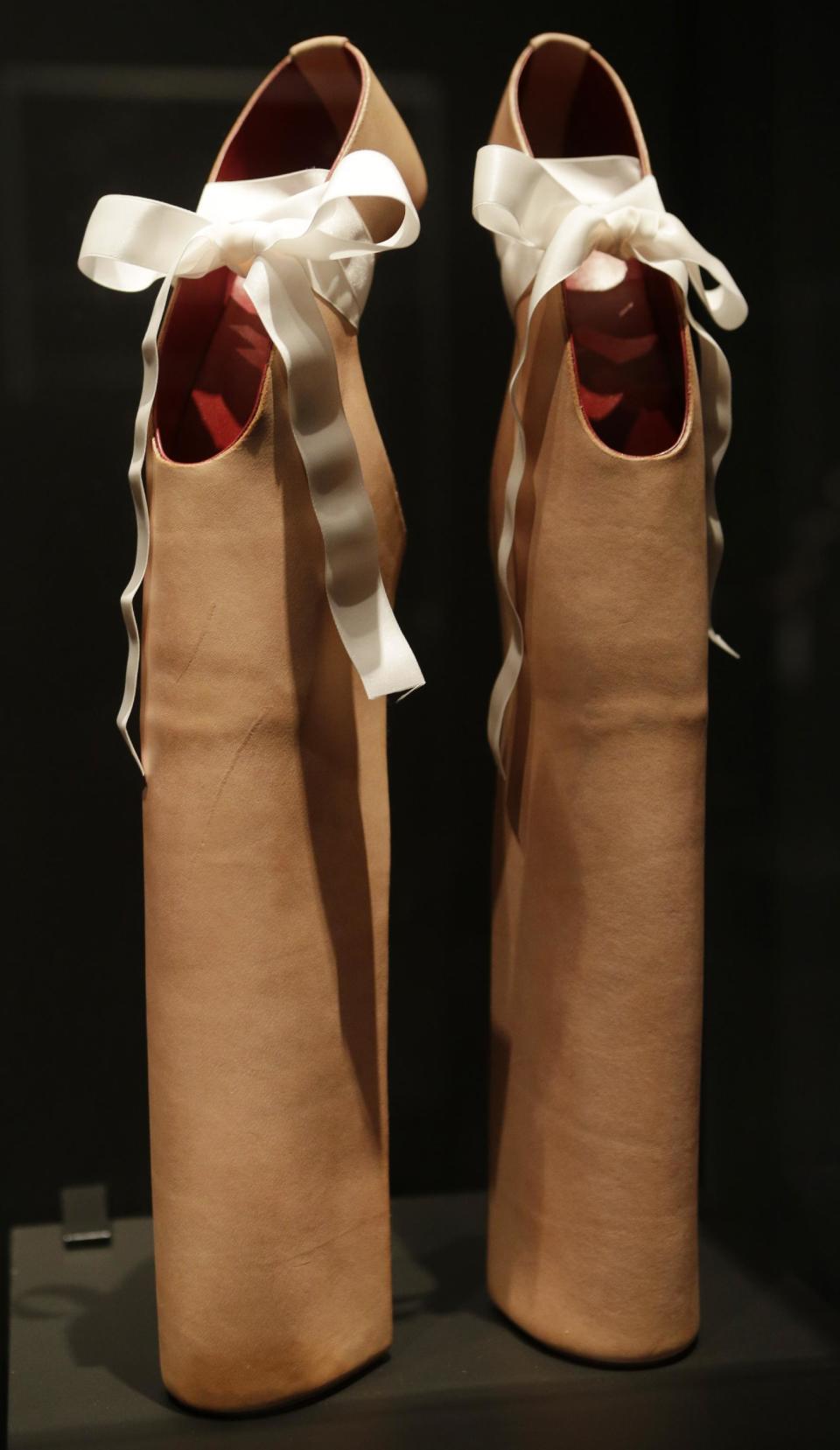 This Feb. 11, 2013 photo shows a pair of shoes designed by Noritake Tatehana for Lady Gaga displayed at the "Shoe Obsession" exhibit at The Museum at the Fashion Institute of Technology Museum in New York. The exhibition, showing off 153 specimens, runs through April 13. (AP Photo/Kathy Willens)