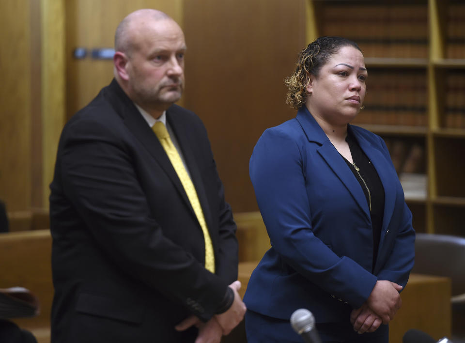 Former New Haven Police Sgt. Betsy Segui, right, with attorney, Gregory Cerritelli, appears in Superior Court in New Haven, Conn., on Thursday, March 28, 2024. Four former Connecticut police officers, including Segui, arrested for allegedly mistreating a man who wound up paralyzed in the back of a police van in 2022 were denied bids Thursday to enter a program that could have erased criminal charges against them and possibly let them avoid trial. (Arnold Gold/Hearst Connecticut Media via AP, Pool)