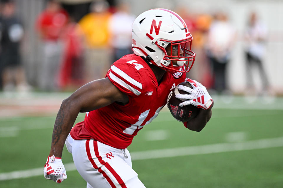 LINCOLN, NEBRASKA - SEPTEMBER 16: Running back Rahmir Johnson #14 of the Nebraska Cornhuskers returns a kickoff against the Northern Illinois Huskies during the first quarter at Memorial Stadium on September 16, 2023 in Lincoln, Nebraska. (Photo by Steven Branscombe/Getty Images)