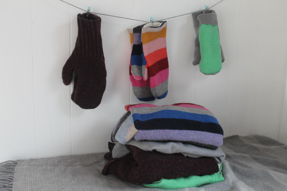 This Feb. 4, 2020 photo taken in Hopkinton, N.H., shows three pairs of handmade mittens, each constructed from sweaters using slightly different techniques. If winter is lasting longer than the groundhog predicted where you live, consider restocking your mitten supply and clearing out your closet at the same time. Instead of tossing stained or accidentally shrunken sweaters, turn them into cozy mittens. (AP Photo/Holly Ramer)