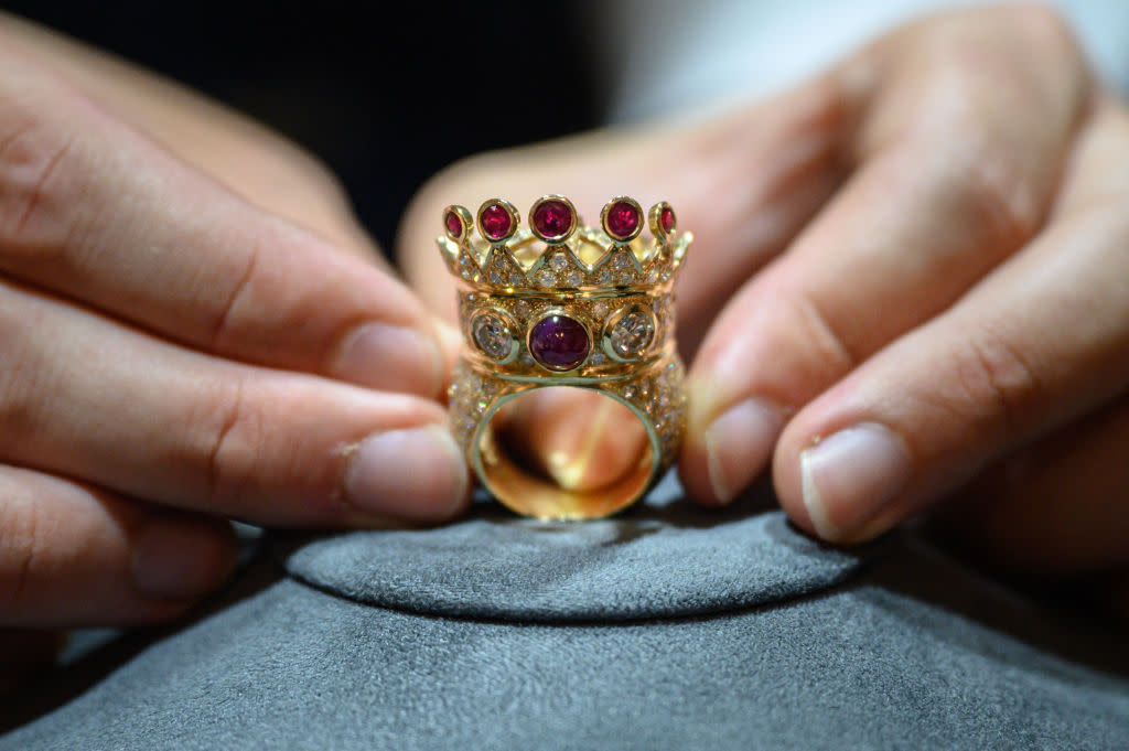 “My only fear of death is comin’ back to this bitch reincarnated,” rapped Tupac Shakur in his song, “Only God Can Judge Me”. Shakur designed this gold, ruby, and diamond crown ring, and wore it during his last public appearance before being fatally shot in his BMW in 1996. (Credit: Ed Jones/AFP via Getty Images)