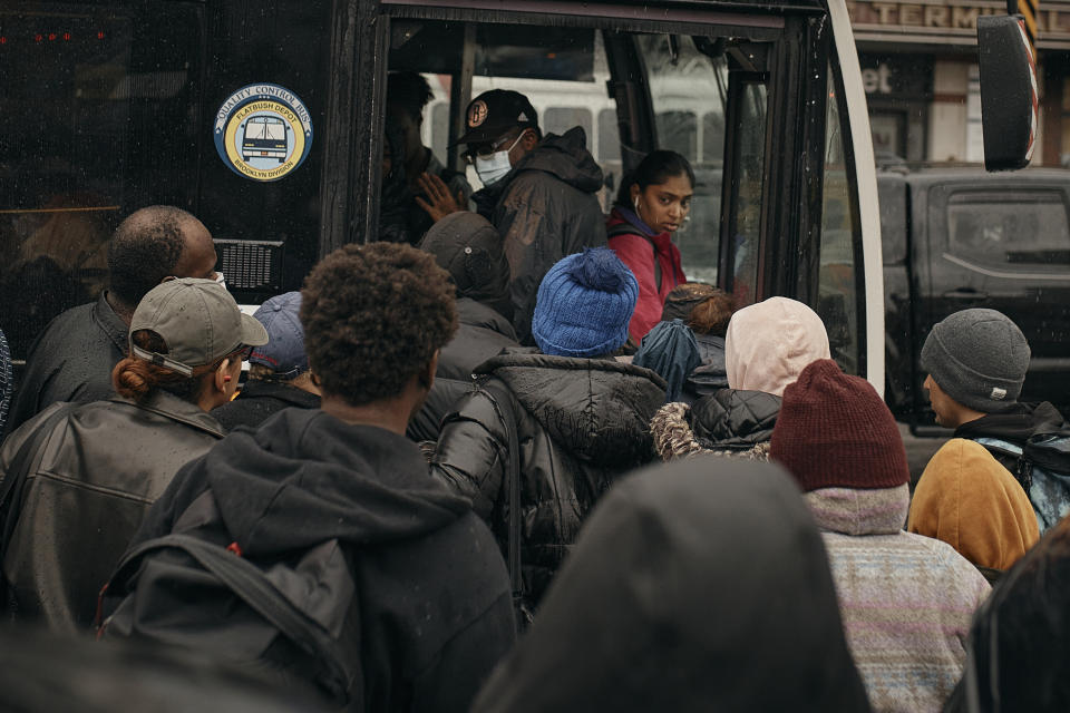 People take the bus as trains have cancelled due to flooding from heavy rains on Friday, Sept. 29, 2023 in the Brooklyn borough of New York. (AP Photo/Andres Kudacki)