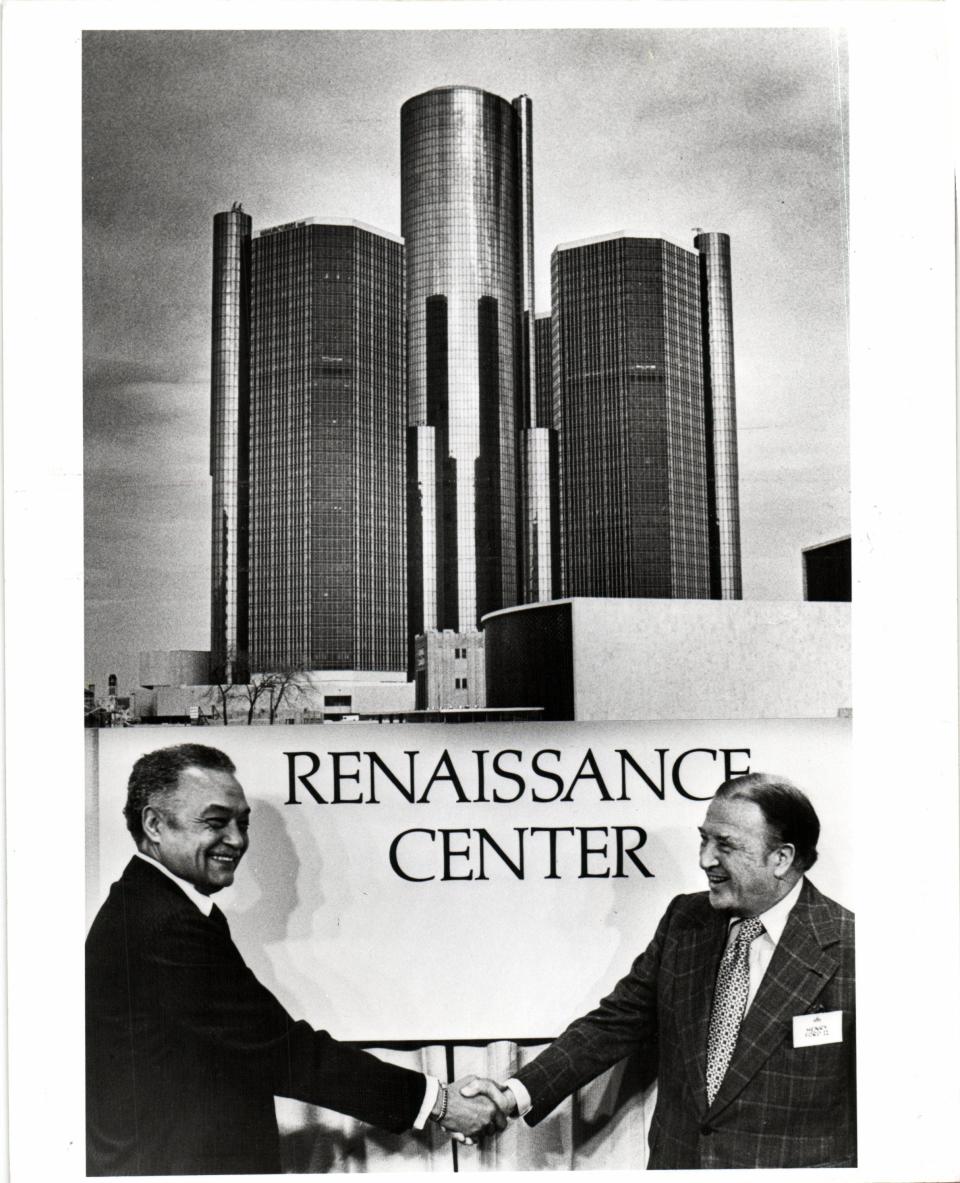 Detroit Mayor Coleman Young and Henry Ford II shake hands during the dedication ceremony of the Renaissance Center in Detroit in 1977. The event featured champagne, cookies in the shape of the towers and an appearance by Bob Hope during a black-tie event.