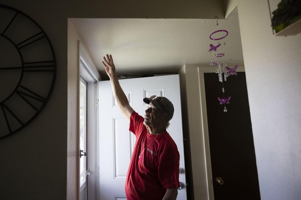 Lorenzo Rodriguez points out the ceiling cracks, new front door and insulation that he paid for and repaired himself at his apartment in Salt Lake City on Friday, June 30, 2023. Tenants of the Housing Assistance Management Enterprise (HAME) apartments delivered a collective letter to the President of HAME demanding an end to the rent increase and the opportunity to negotiate collectively for a fair lease. | Laura Seitz, Deseret News